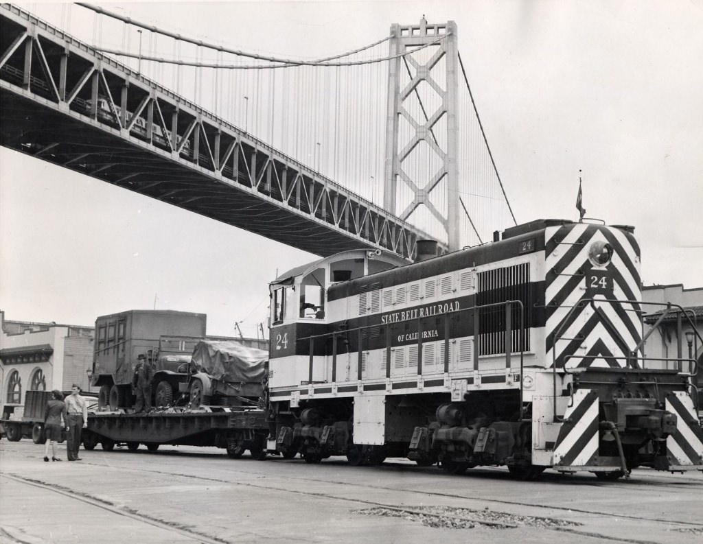 Freight train stopped under the Bay Bridge at the San Francisco waterfront, 1946