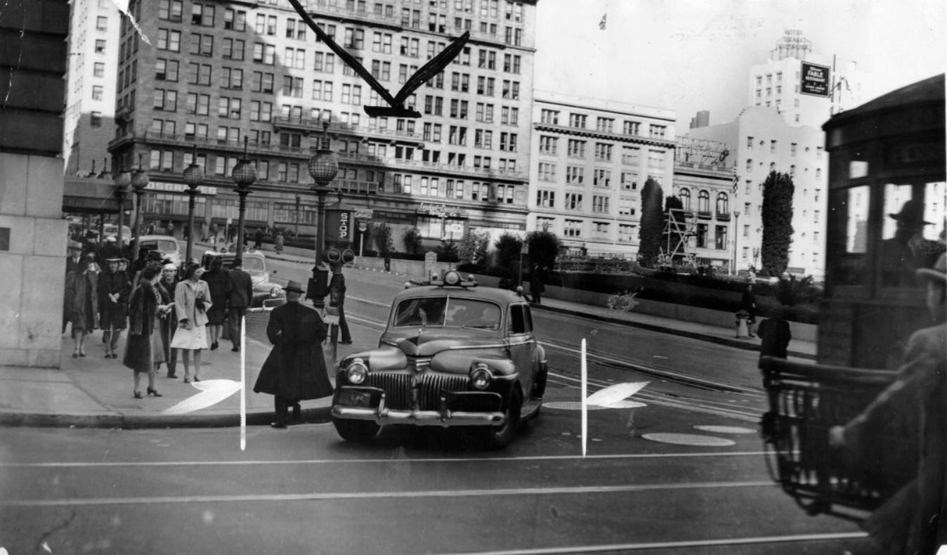 Automobile turning onto Powell Street from Geary, 1944