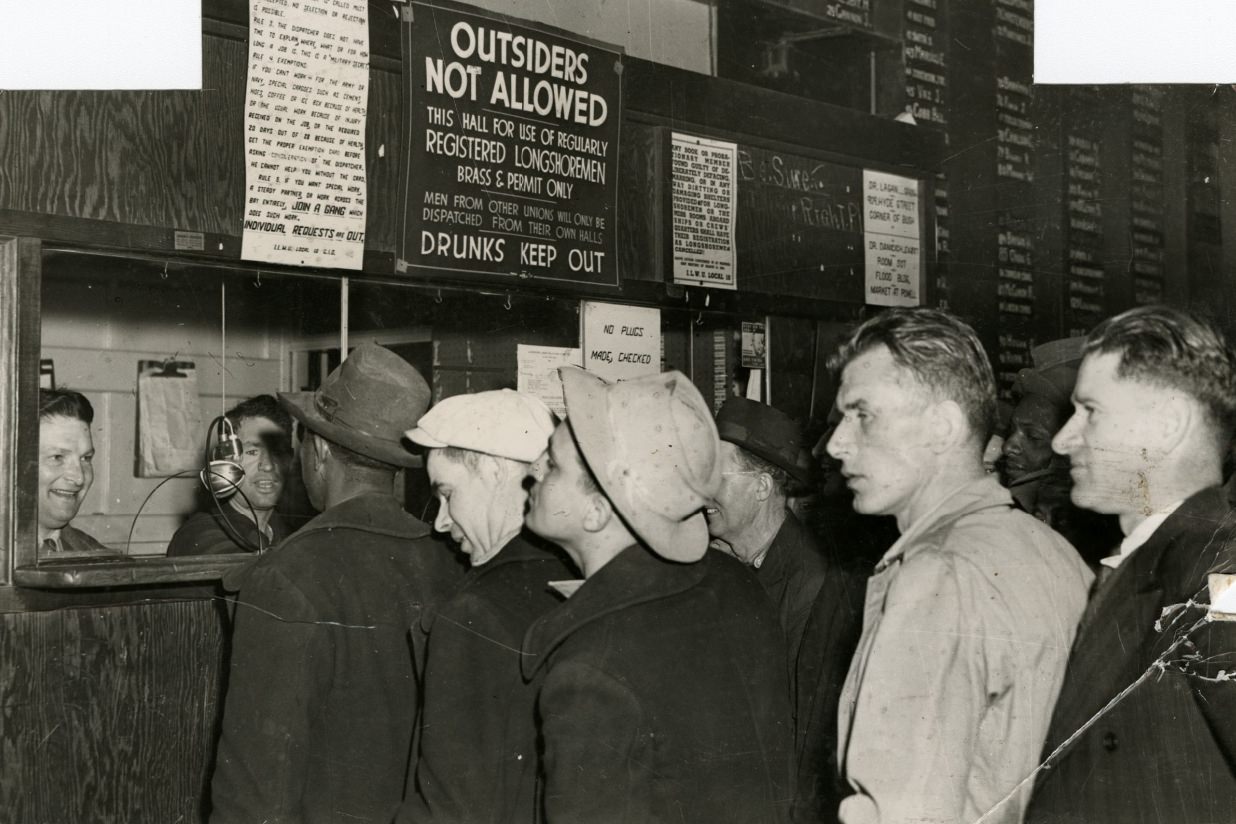 Men standing in lines in the dispatcher's office, 1946