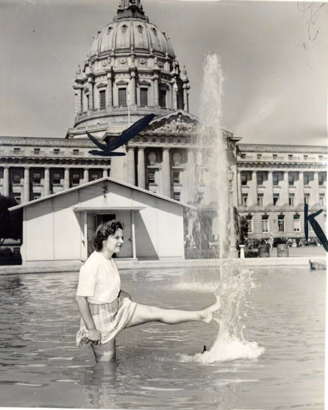 Edyth Tornow wading in pool in front of City Hall, 1946