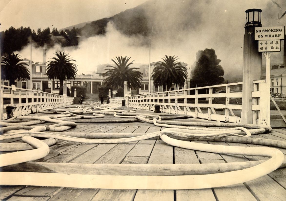 Fire hoses on Angel Island wharf during blaze, 1940