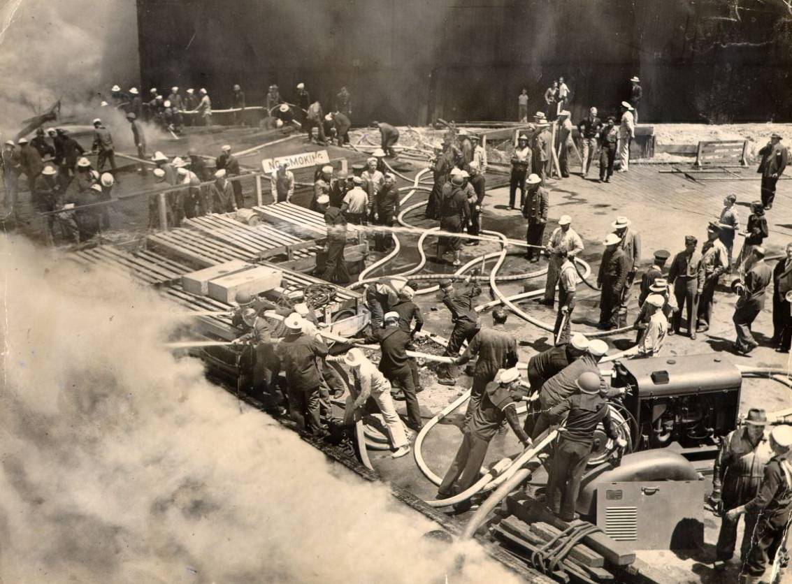 Firemen fighting fire at United Fruit Company Pier at Third and Channel streets, 1943