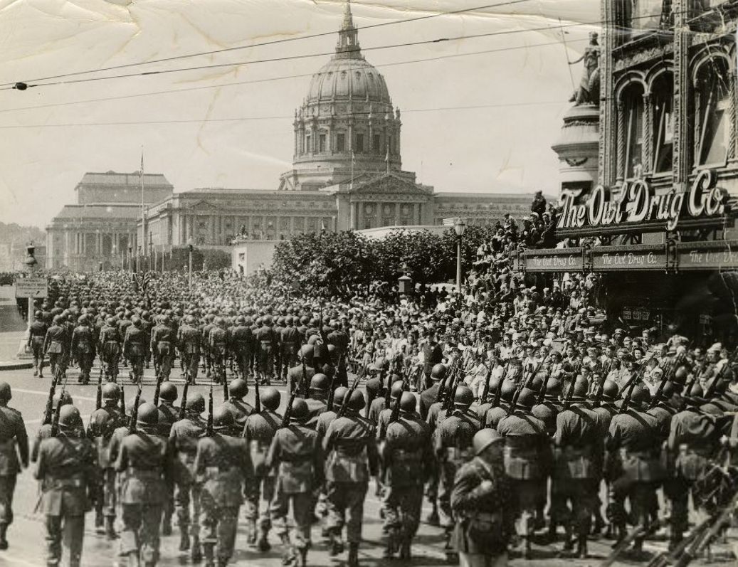 U.S. Army troops parading toward City Hall, 1945