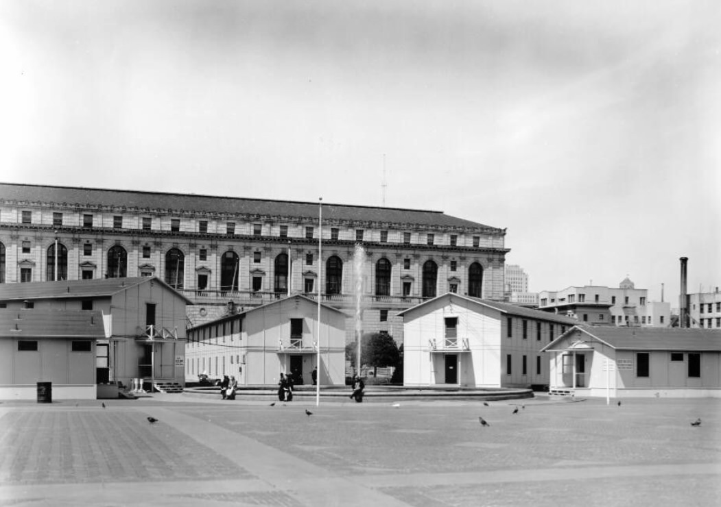 People in Civic Center Plaza surrounded by Temporary Barracks, 1940s