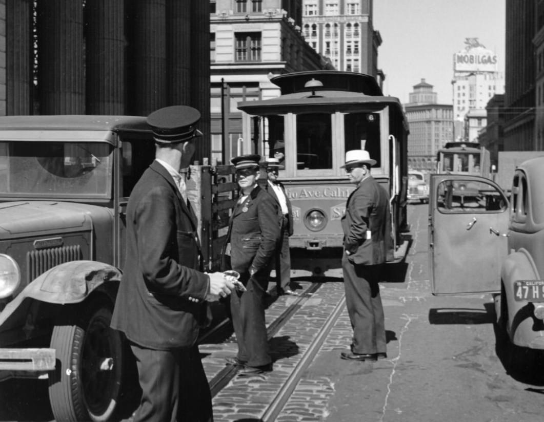 Men in front of a cable car on California Street, 1940s