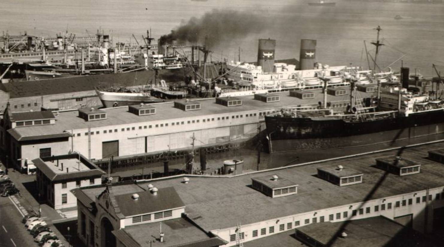 View of ships docked at San Francisco piers, looking north from the Bay Bridge, 1946
