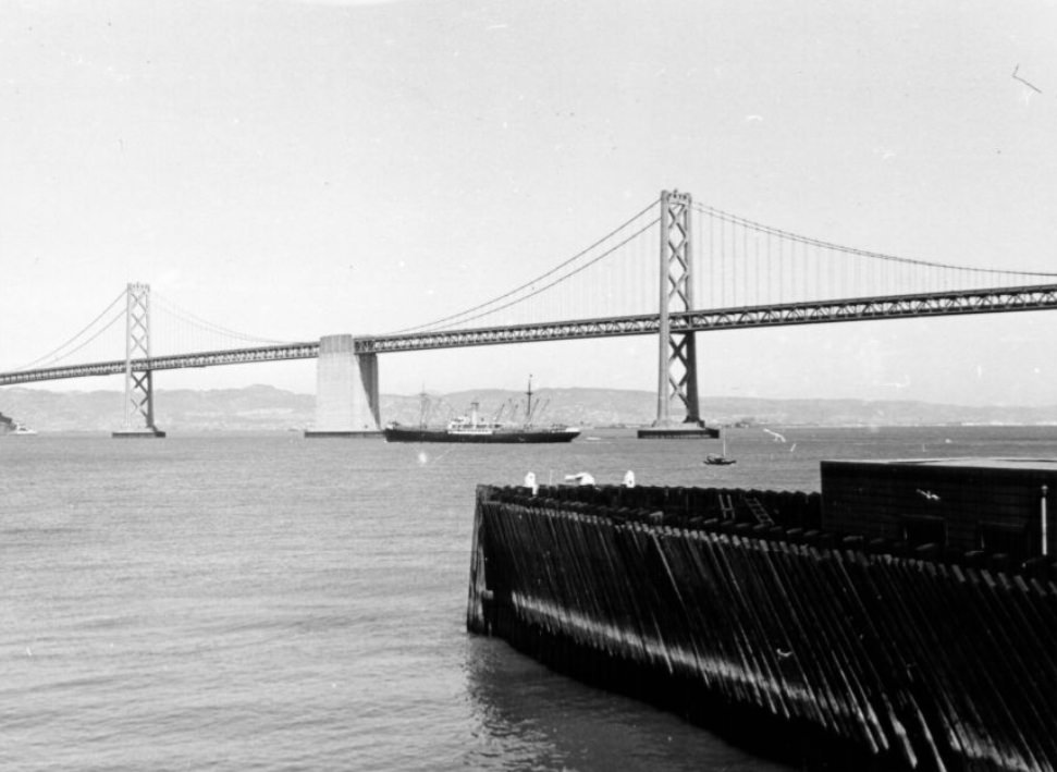View of the Bay Bridge from a San Francisco pier, 1940s
