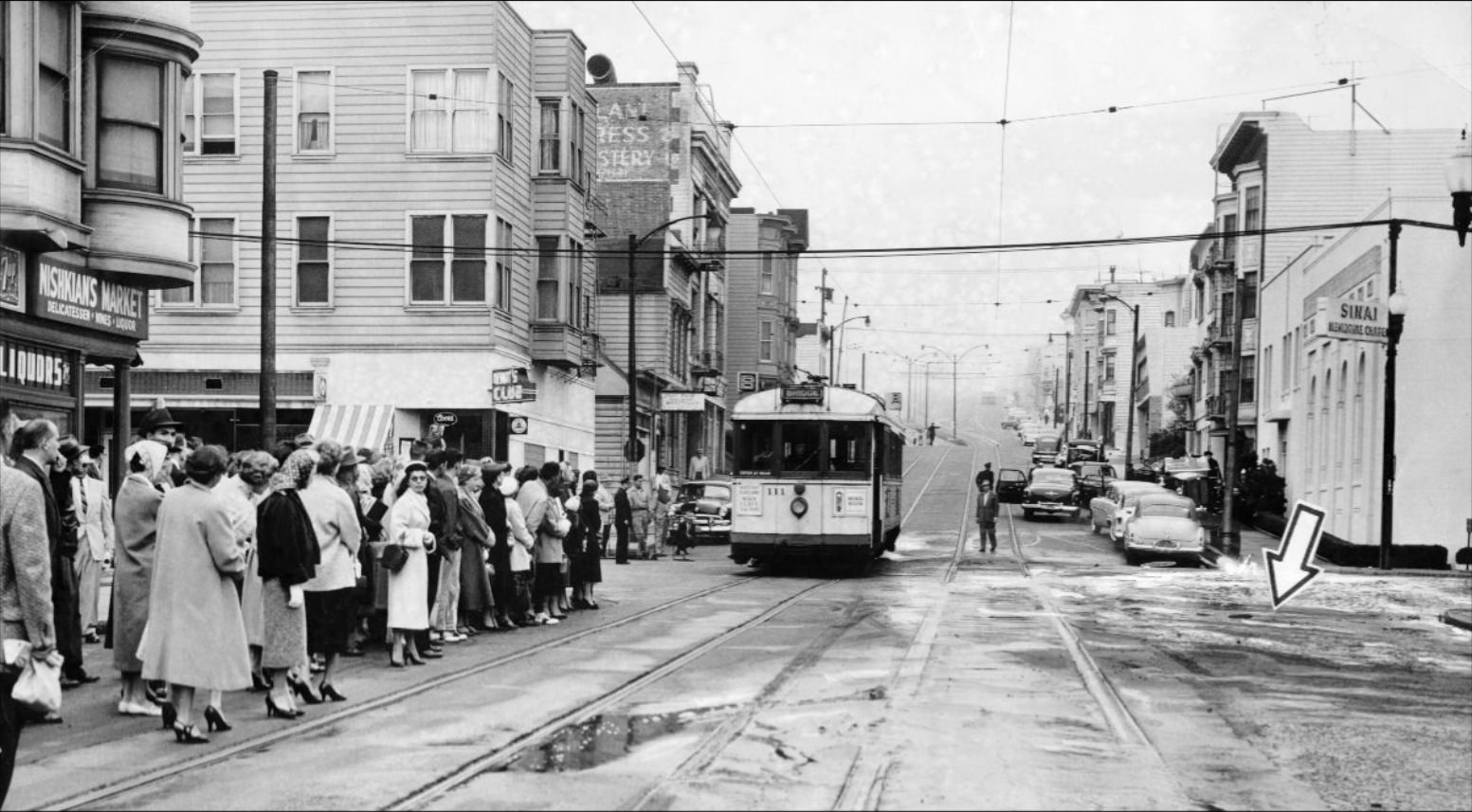 Site of a water main break at Geary and Divisadero, 1956.