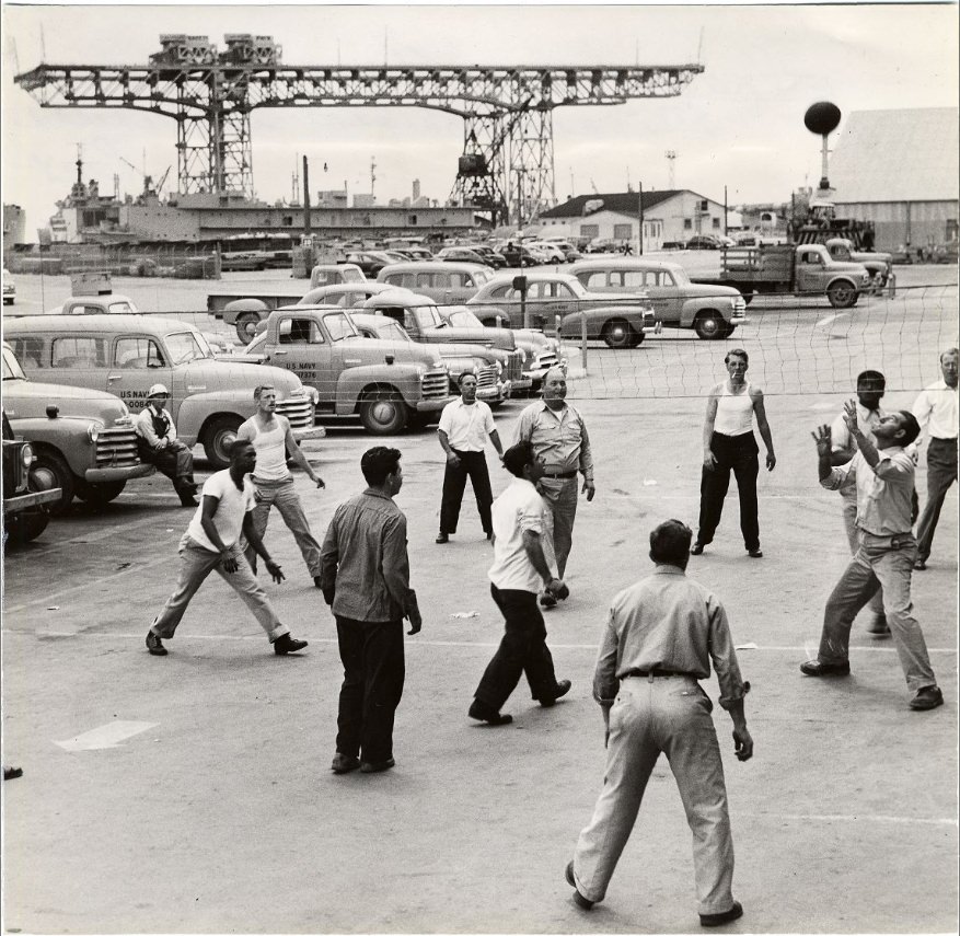 Workmen playing volleyball at Hunter's Point Naval Shipyard, 1953.