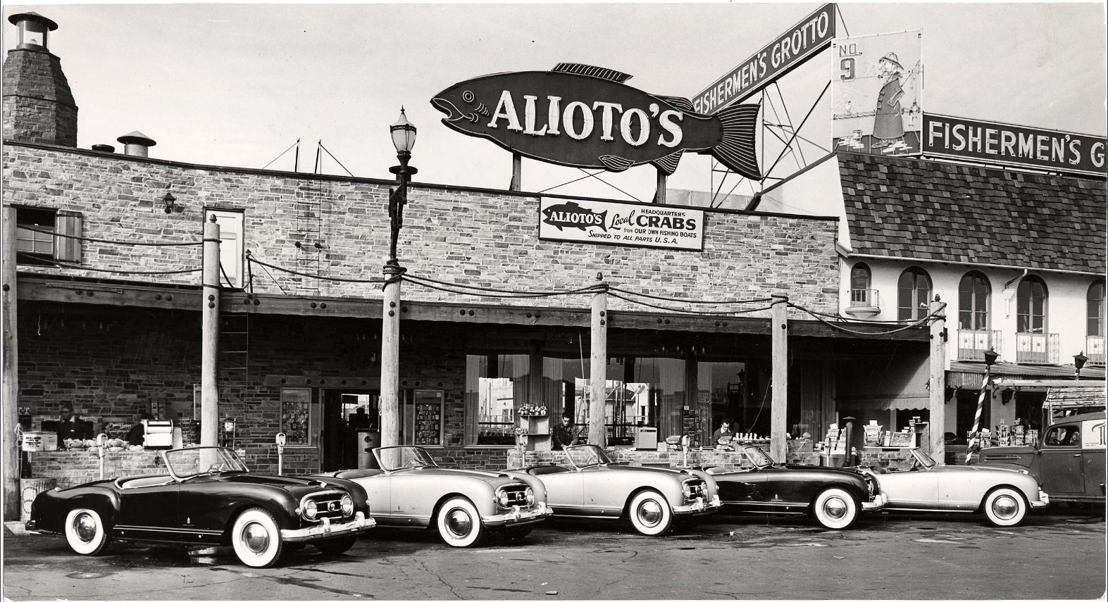 Nash-Healeys parked outside Alioto's restaurant in Fisherman's Wharf, 1953.