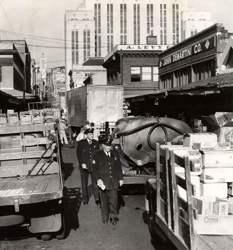 Police issuing tickets to delivery trucks on Washington Street, 1956.
