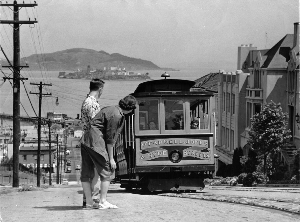 Dwane Hodgson and Carol Lyle watch a Hyde Street Cable Car, 1953.