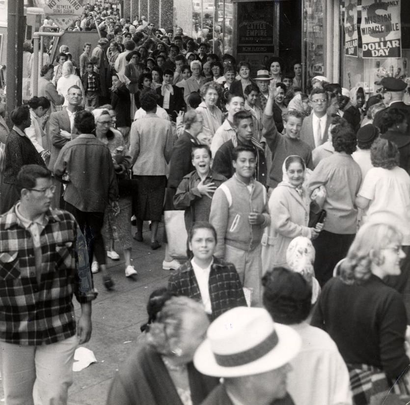 A crowd of people on Mission Street, 1958.