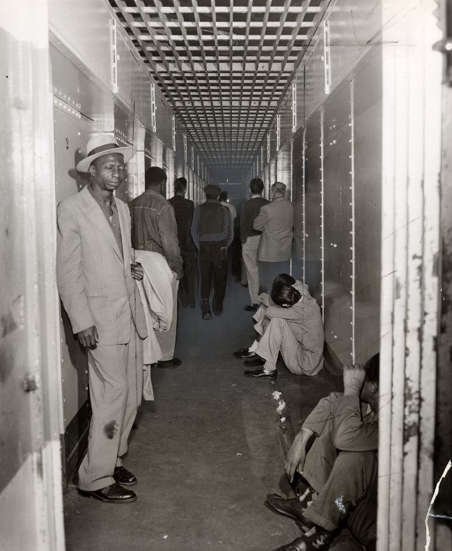 A narrow corridor used as a jail dining and recreation area in the Old Hall of Justice, 1956.