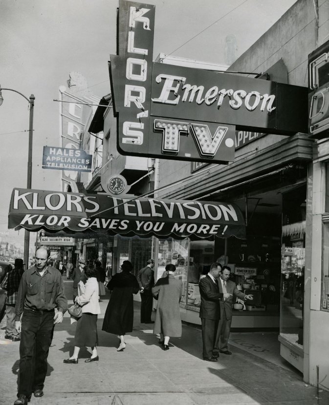 George Klor and Al Schmidt outside Klor's Television and Appliance store, 1954.