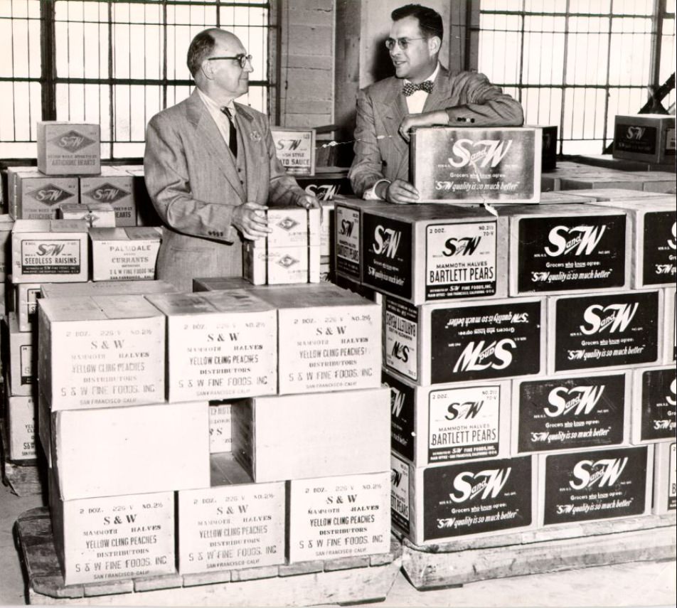 James L. Roney and Joseph Blumlein inspect a shipment at the San Francisco waterfront, 1950.