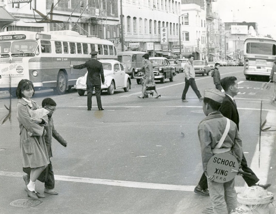 Policeman directing traffic at Washington and Stockton streets, 1965.