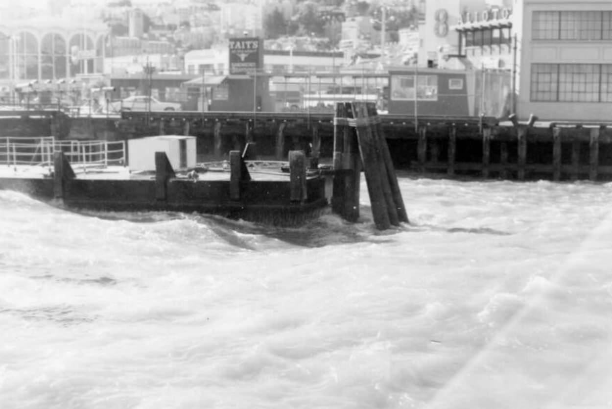 Choppy waves along Fisherman's Wharf, 1960s.