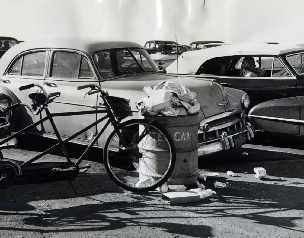 Overflowing trash can at Ocean Beach, 1960.