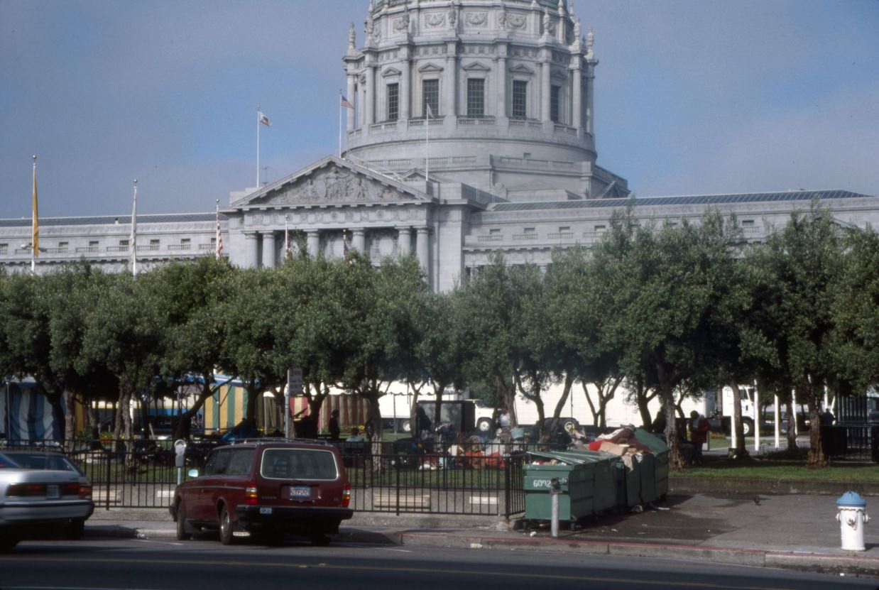 Festival tents next to homeless encampment at Civic Center Plaza, 1989.