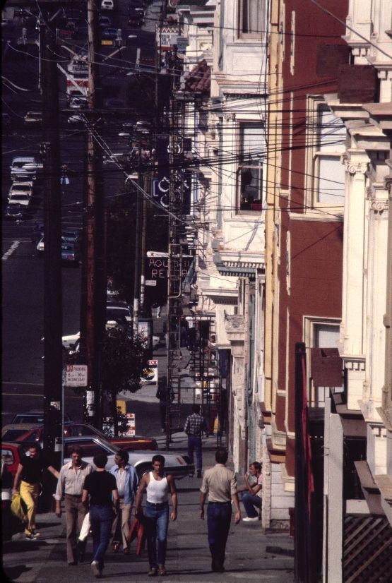 People walking up and down a street, 1980.
