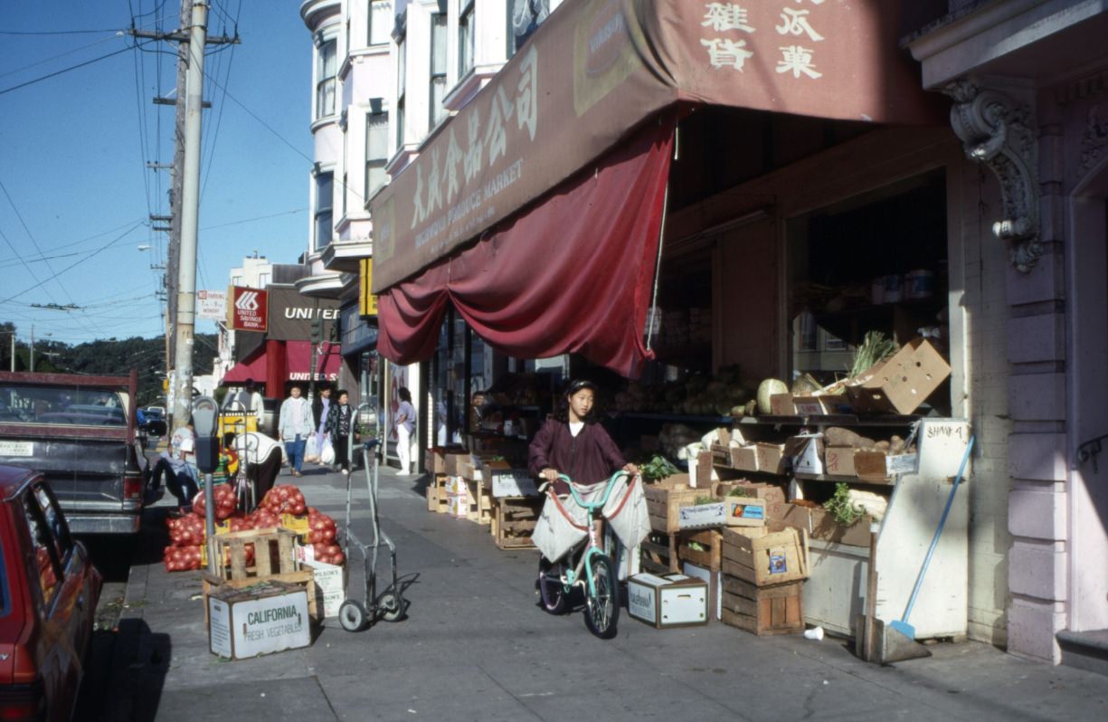 6th Avenue looking north towards Clement Street, Richmond Produce Market, United Savings Bank, 1992.