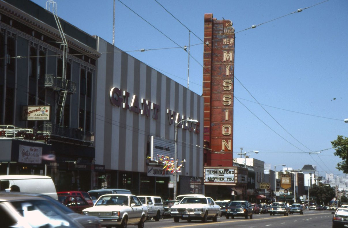 Mission Street looking towards 21st Street, Taqueria Alteña, Giant Value, New Mission Theatre, 1991.