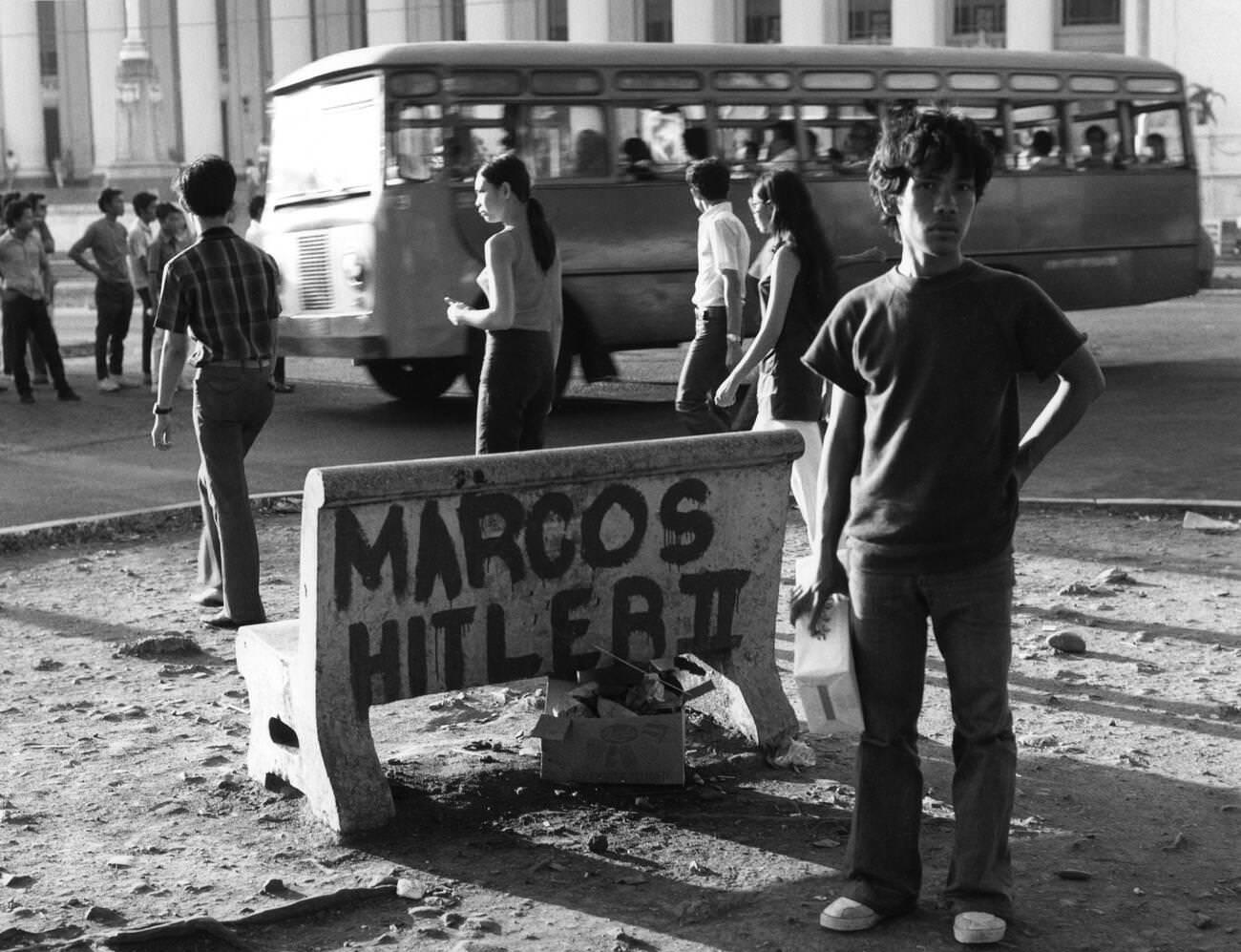 A bench in Manila, Luzon, Philippines, with the slogan "Marcos Hitler II" against President Ferdinand Marcos, 1972.