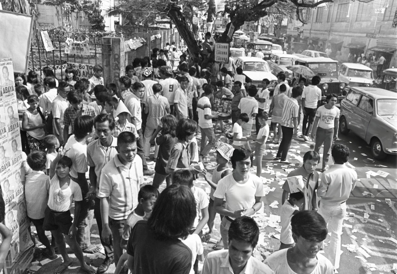 Crowded polling location in Manila during the Philippines' bloodiest election campaign in its 25-year history, with a potential death toll reaching 200.