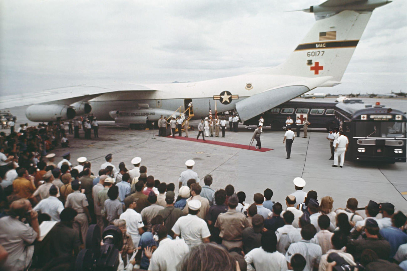 American POWs return from Vietnam, walking from a Lockheed C-141 Starlifter to ambulances at Clark Air Base, Philippines, February 1973.