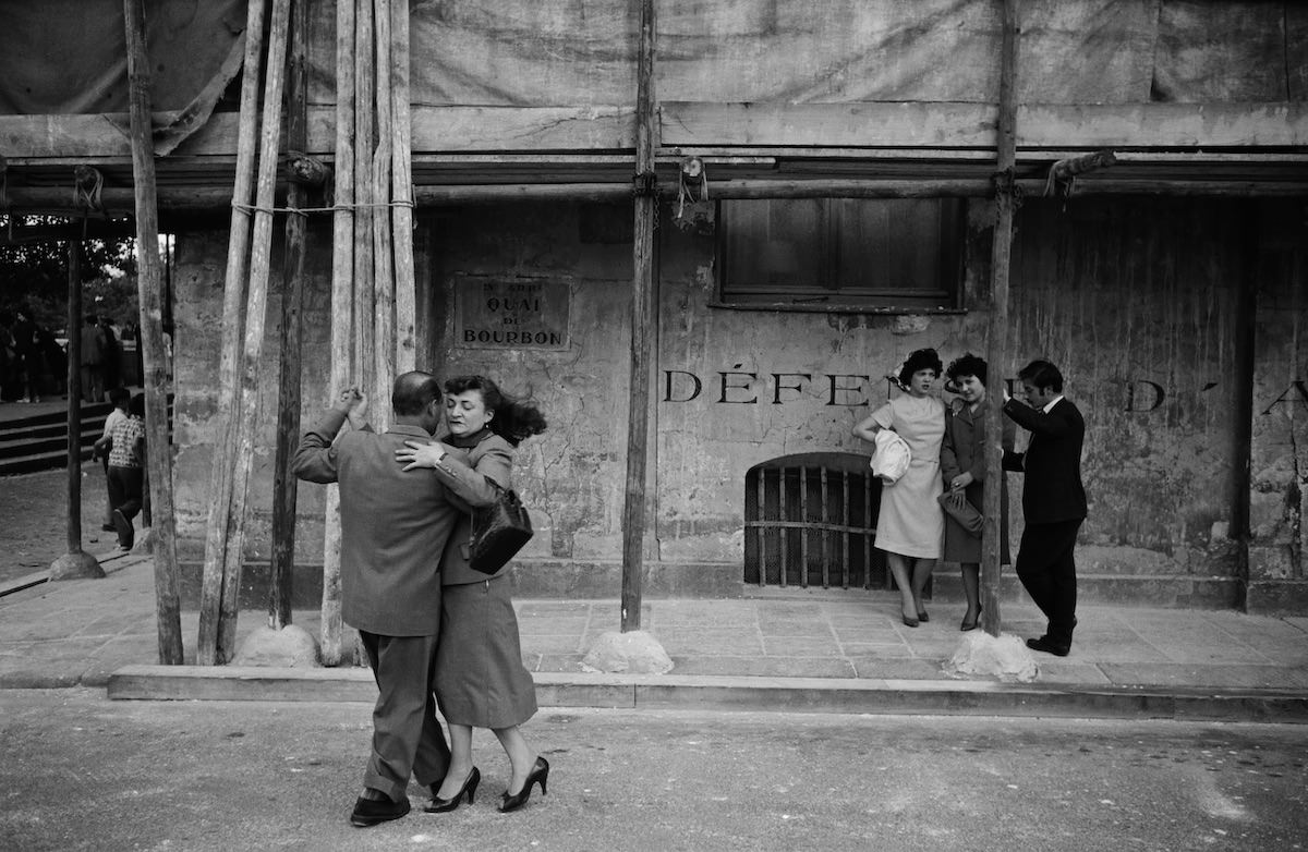 Dancing scene on the Ile Saint-Louis in Paris, taken during the ‘Quatorze Juillet’ [Bastille Day] celebration in 1958.