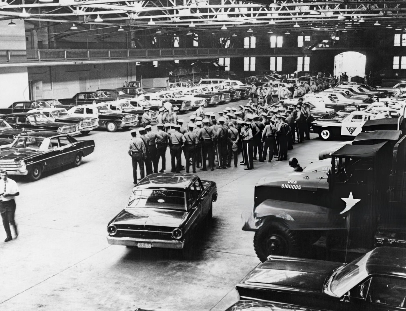 Newark police briefing officers in a warehouse before they head out into the riots taking place in Newark, New Jersey, 1960s.