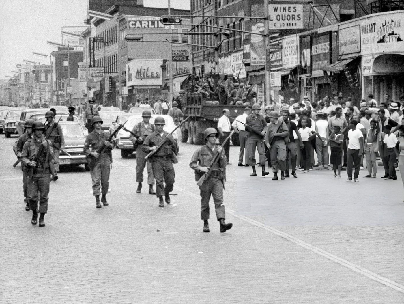 National Guard troops start to deploy into Springfield Ave., the scene of heavy rioting, 1960s.