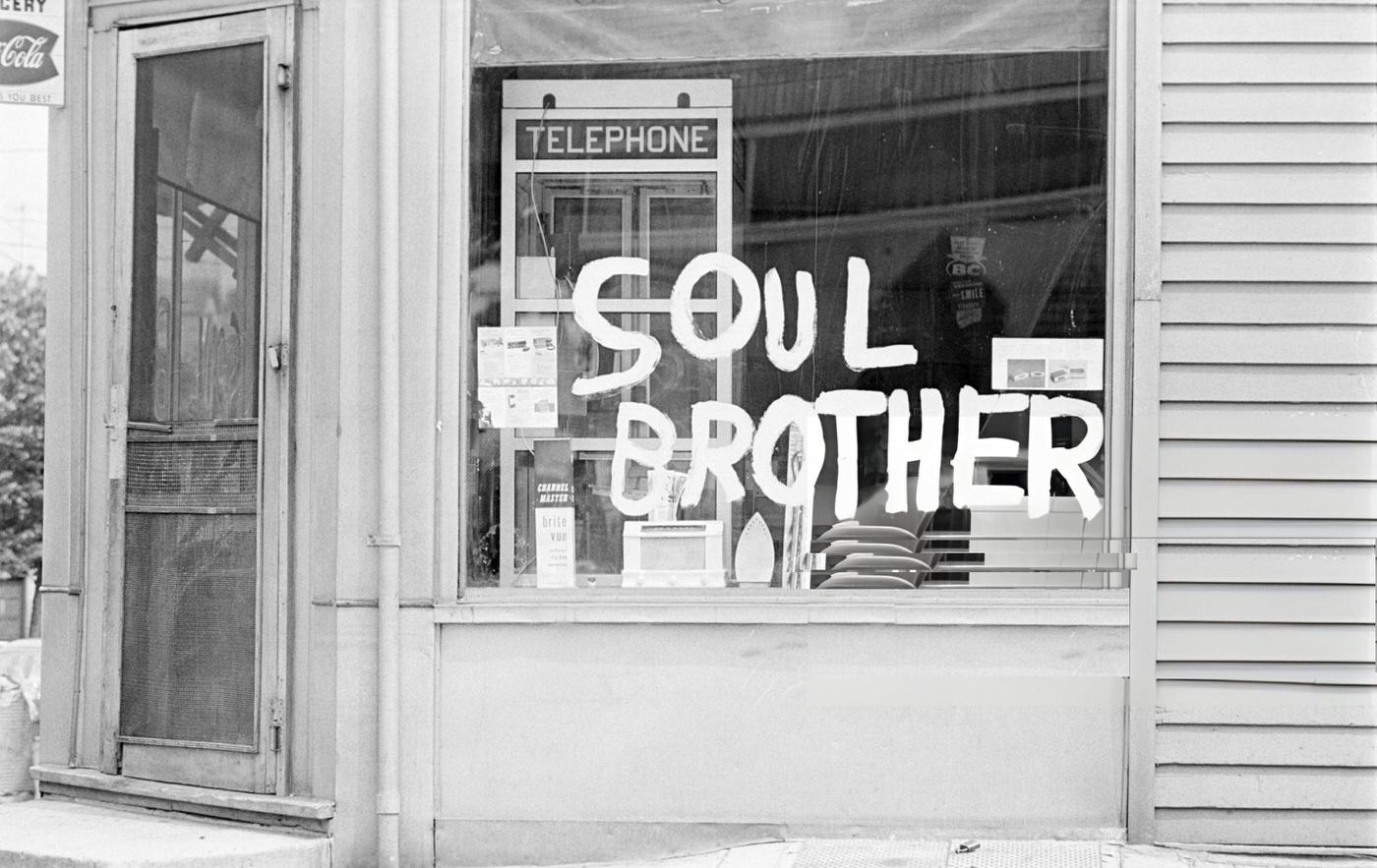 A shop window belonging to the African-American community, protected from looting, with the inscription 'Soul Brothers', 1960s.