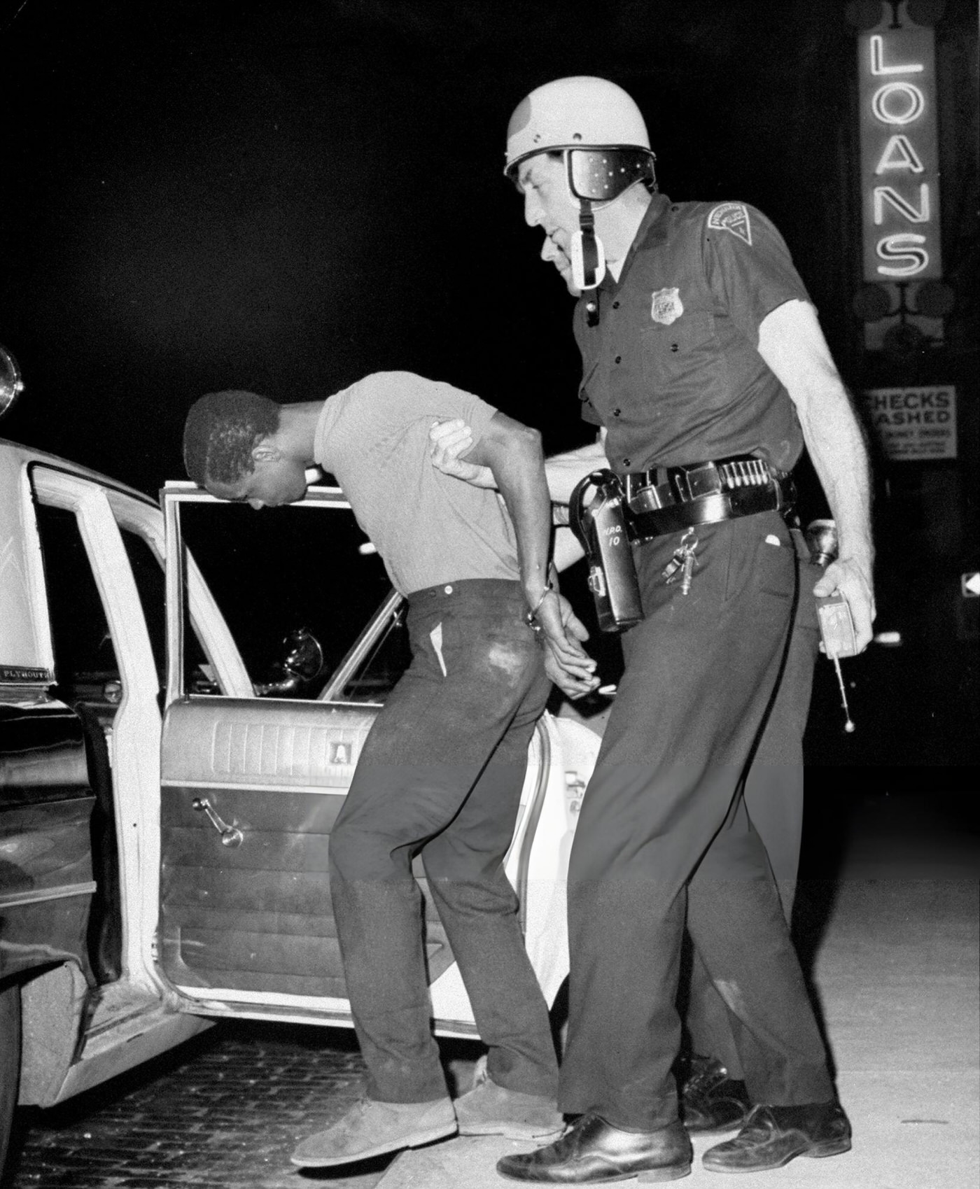 Newark Police arrest a looter at Springfield Ave. and Mercer St. during riots