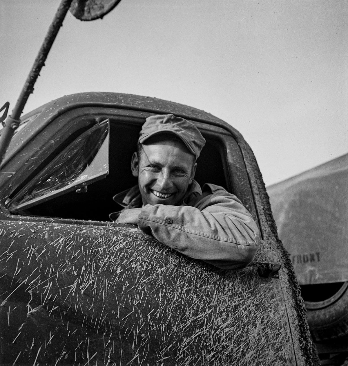 Private Zeno W. Muhl of Baltimore, Maryland. He owns his own dump truck in civilian life.