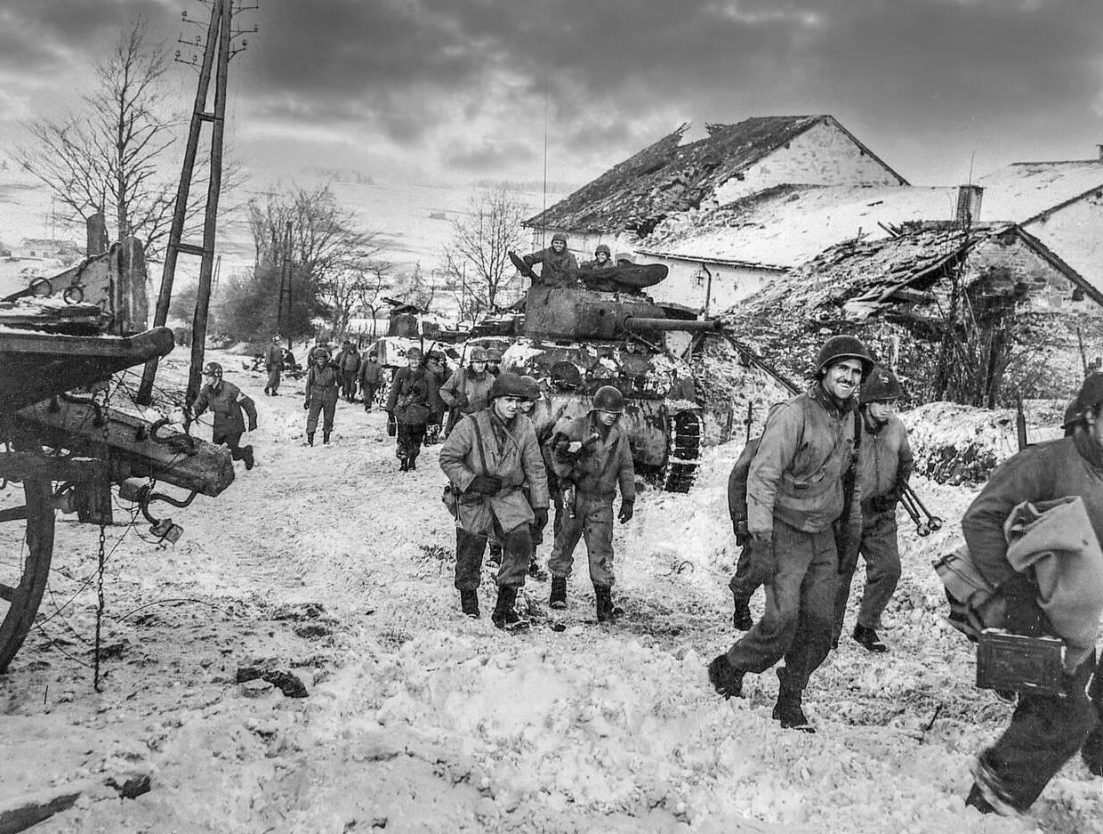 American soldiers slog through the mud and snow during the Battle of the Bulge in December 1944. It was the coldest winter in 50 years in Europe and developed into the biggest battle with Nazi Germany Occupation on the Western Front during World War II.