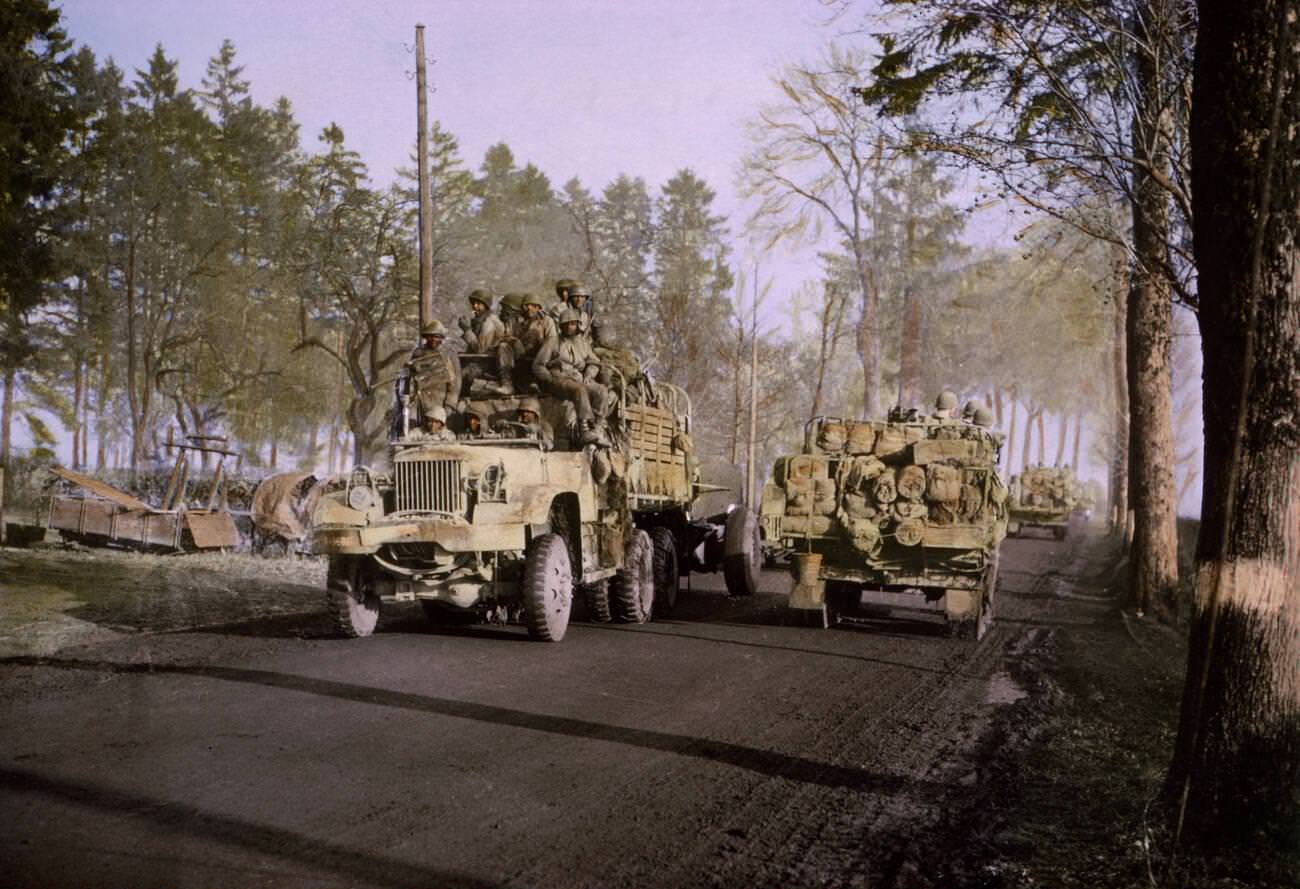 Battle-weary troops being relieved of front-line duty as reinforcements arrive to take over, 1945.