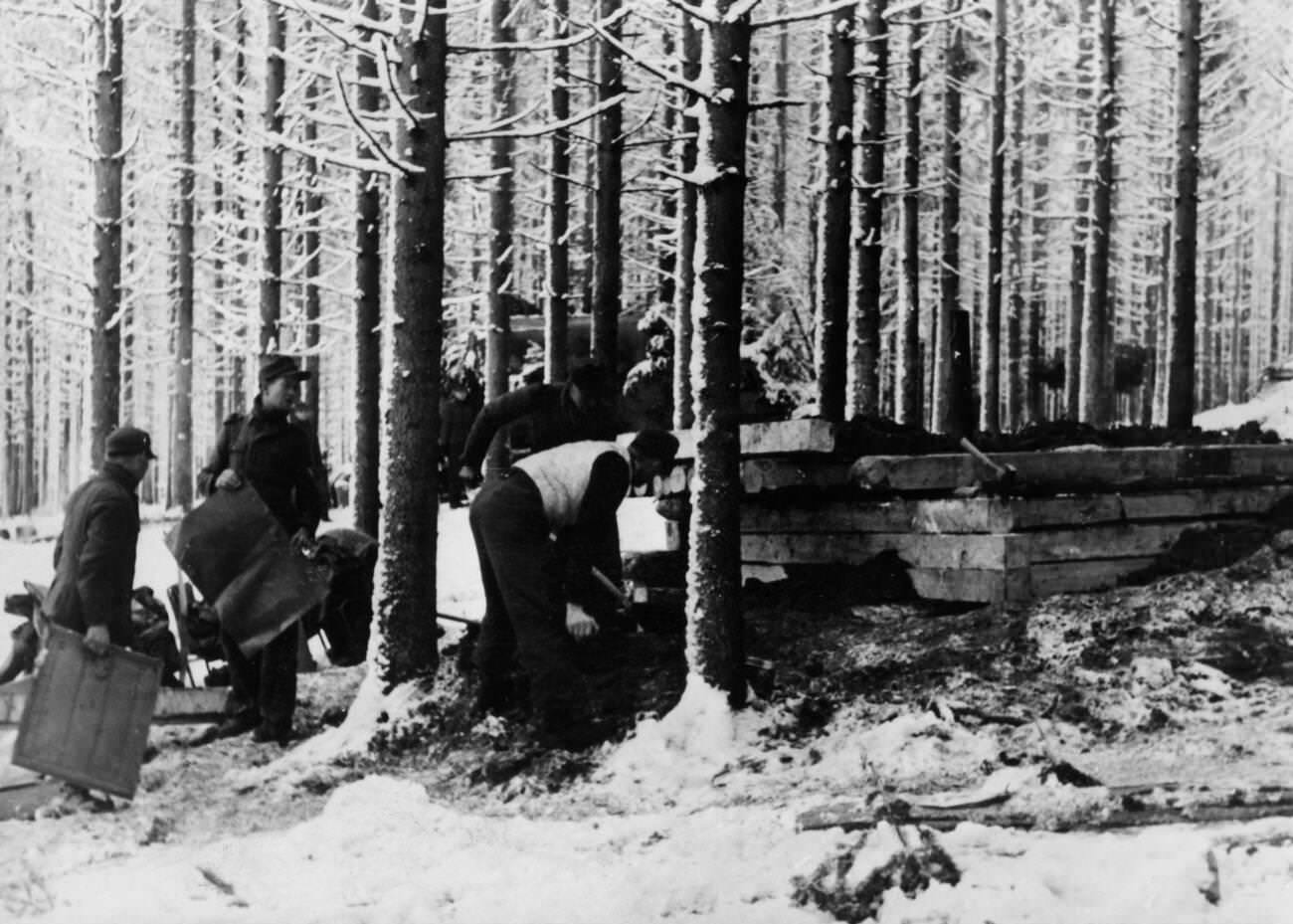 Construction of a wooden bunker during the Battle of the Bulge, 1945.