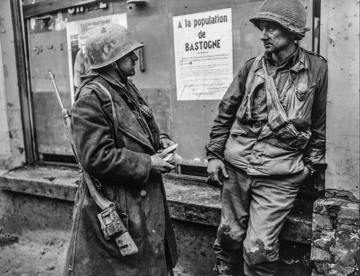 Battle weary infantrymen in Bastogne, Belgium, 1944.