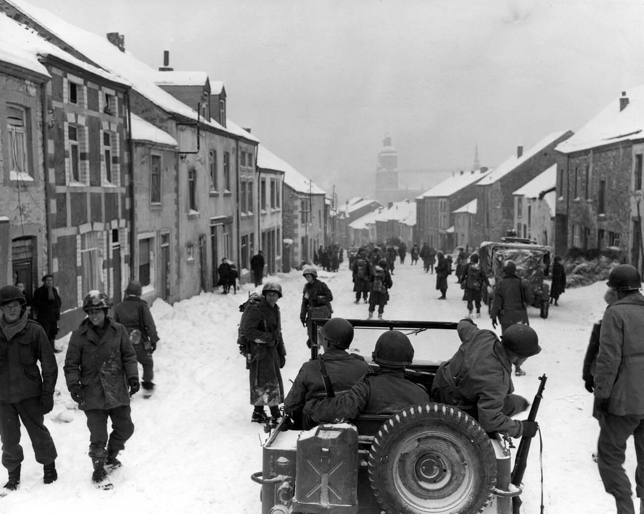 American soldiers of the 87th Division enter the town of St Hubert in Belgium shortly after the German occupiers had left, 1945.