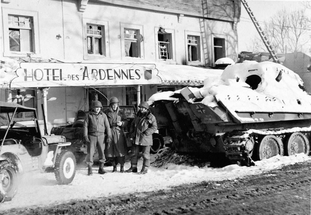 Officers of the 9th U.S. Air Force in front of a disabled German tank, 1945.