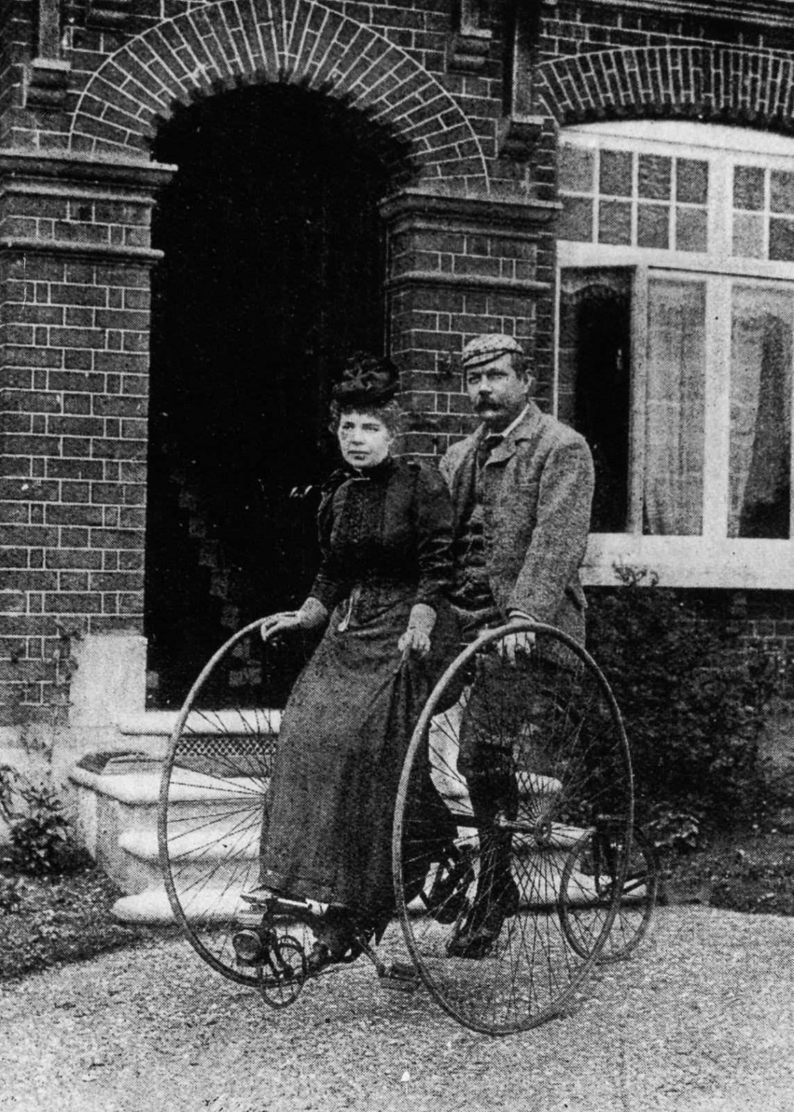 Sir Arthur Conan Doyle and his wife ride a tandem tricycle, 1895.