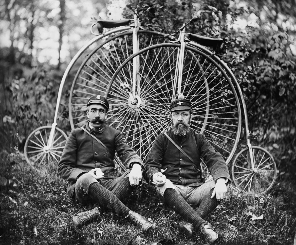 "Wheelmen" pose with their penny-farthing cycles, 1890s.