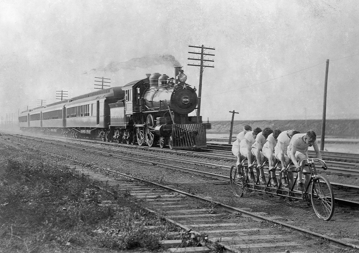 "The Stearns Sextuplets" attempt to outride a train pulling four cars, 1896.