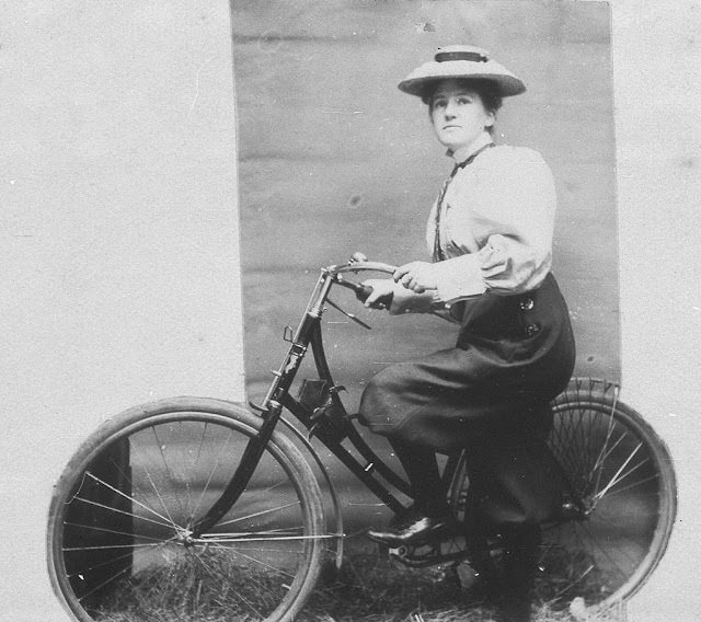 Annie Dawson Wallace with her bicycle. NB- Annie is wearing trousers, 1899.