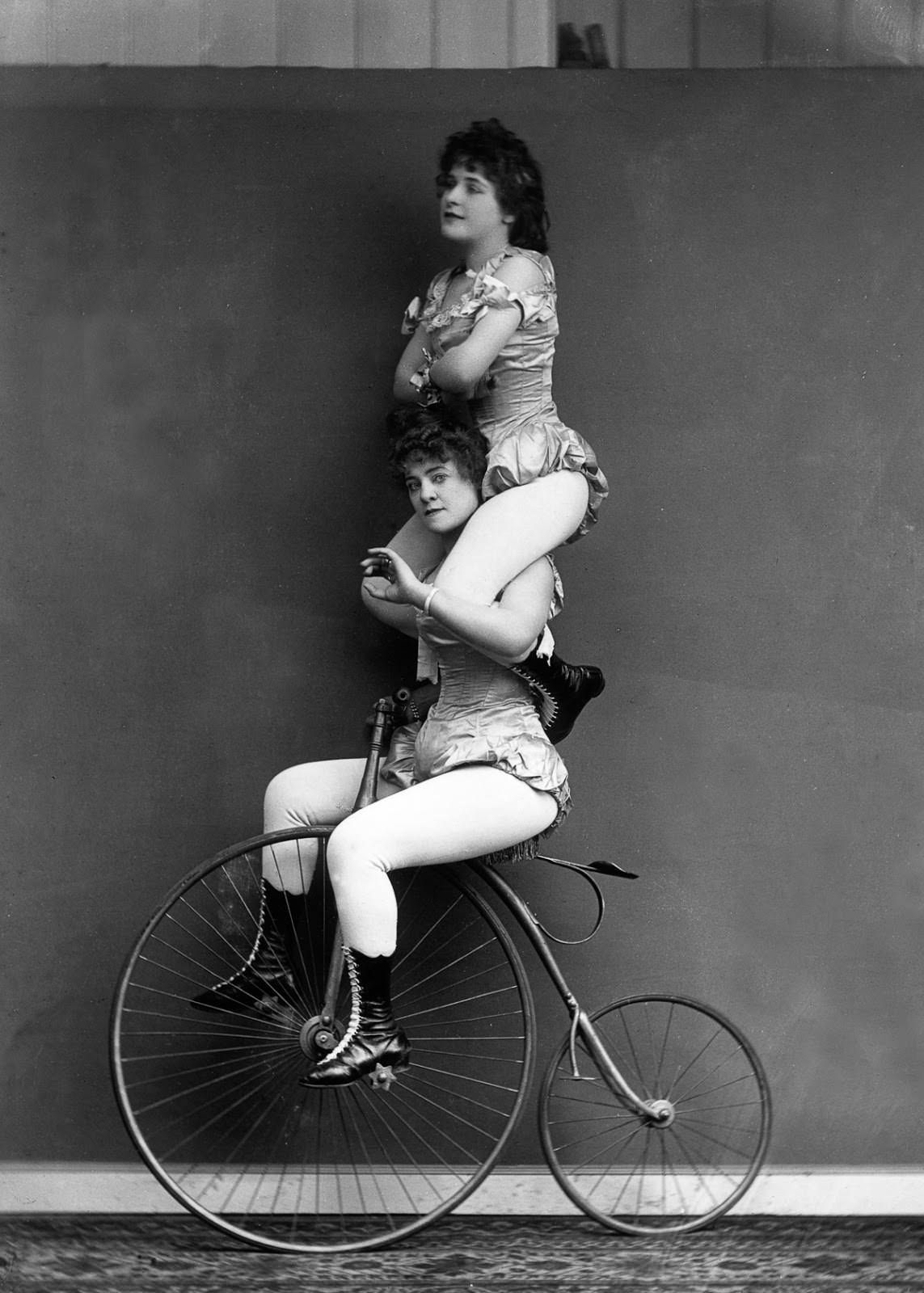 Victorian cyclists perform a balancing act on a penny-farthing, 1891.