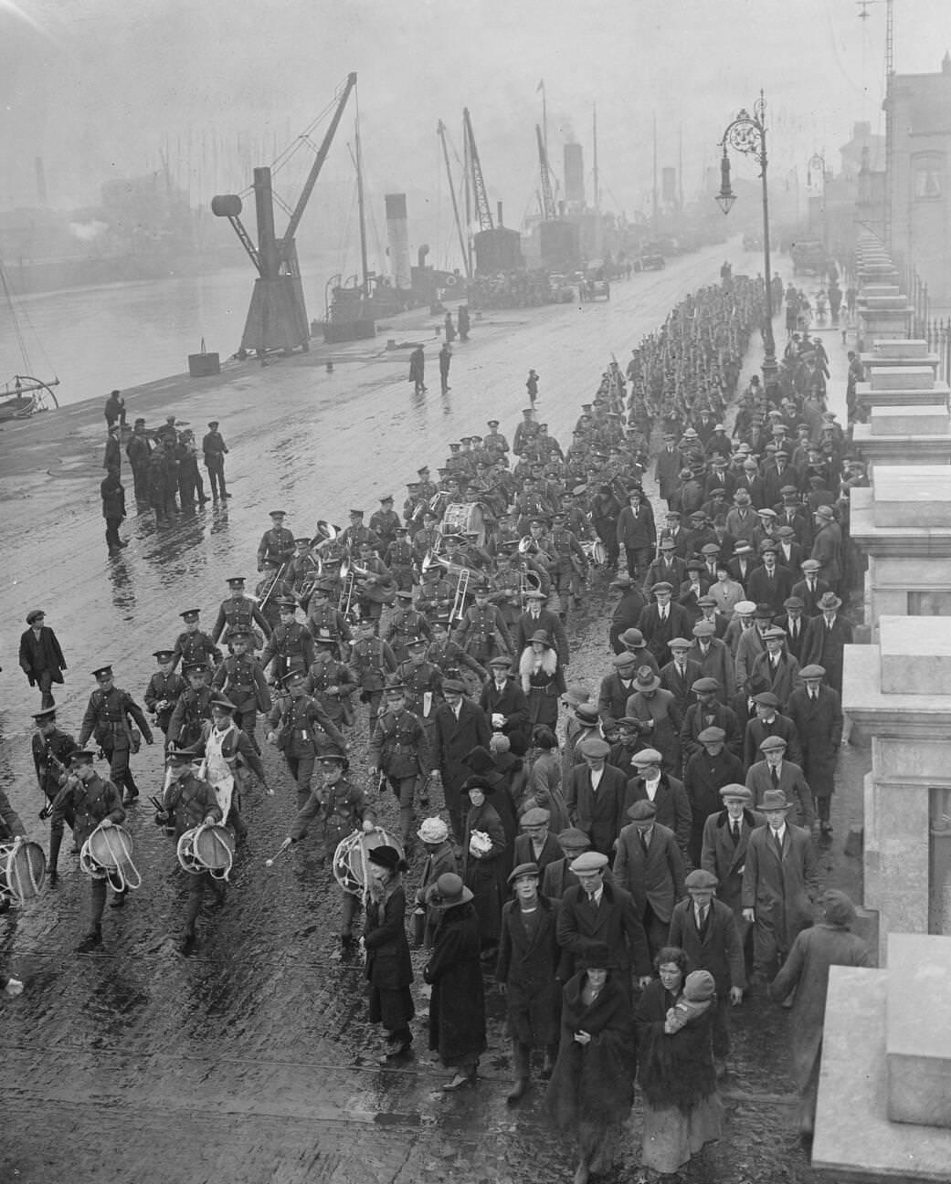 An embarkation scene as British troops evacuate Ireland, 1922.