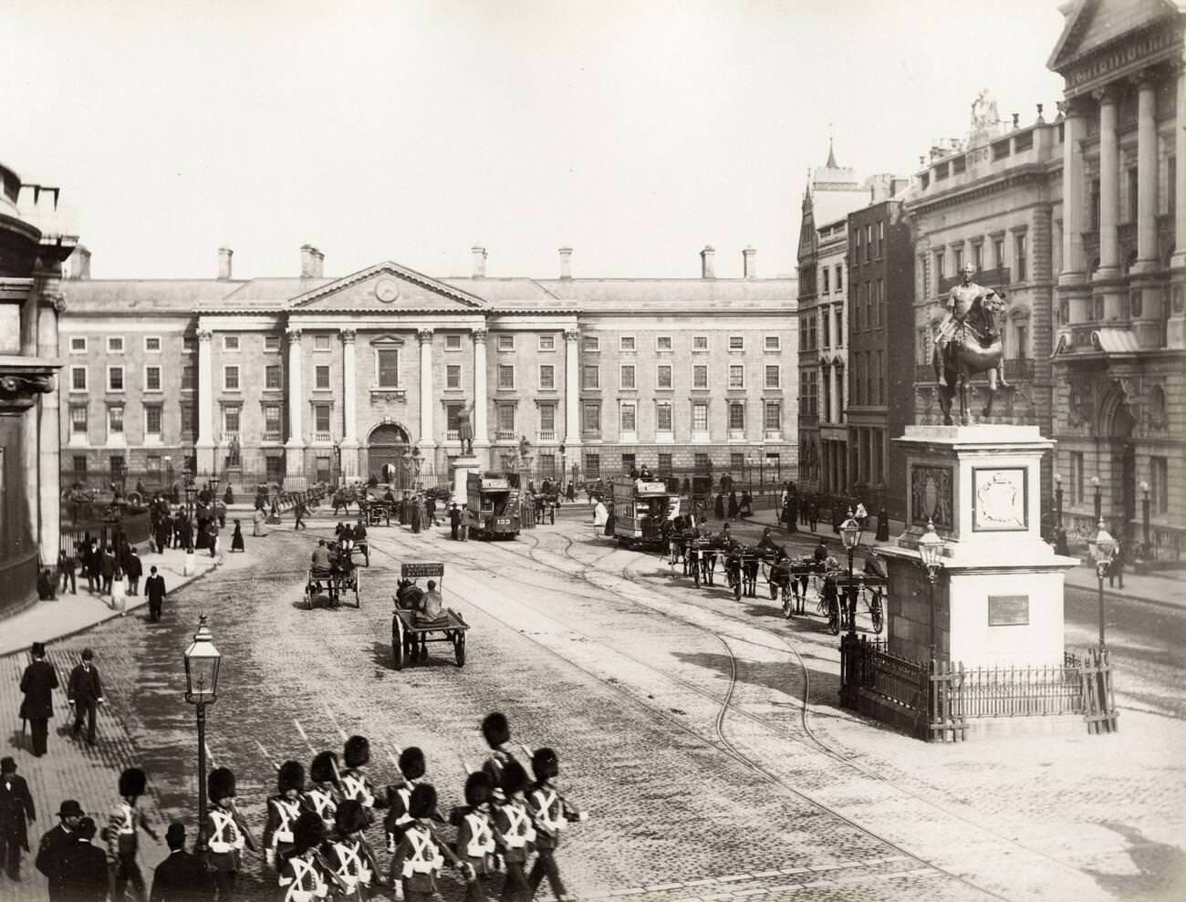 British soldiers marching outside the front gate of Trinity College Dublin, Ireland, 1890s