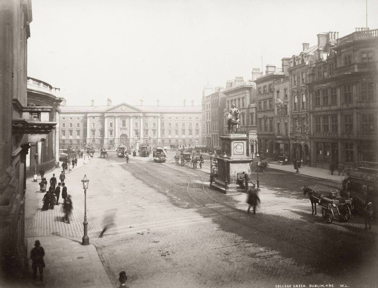 College Green Dublin, with Trinity College in the background, horses and trams, 1890s